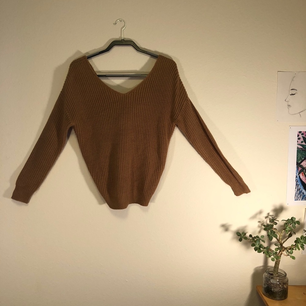 Cute tan sweater with twist in the back